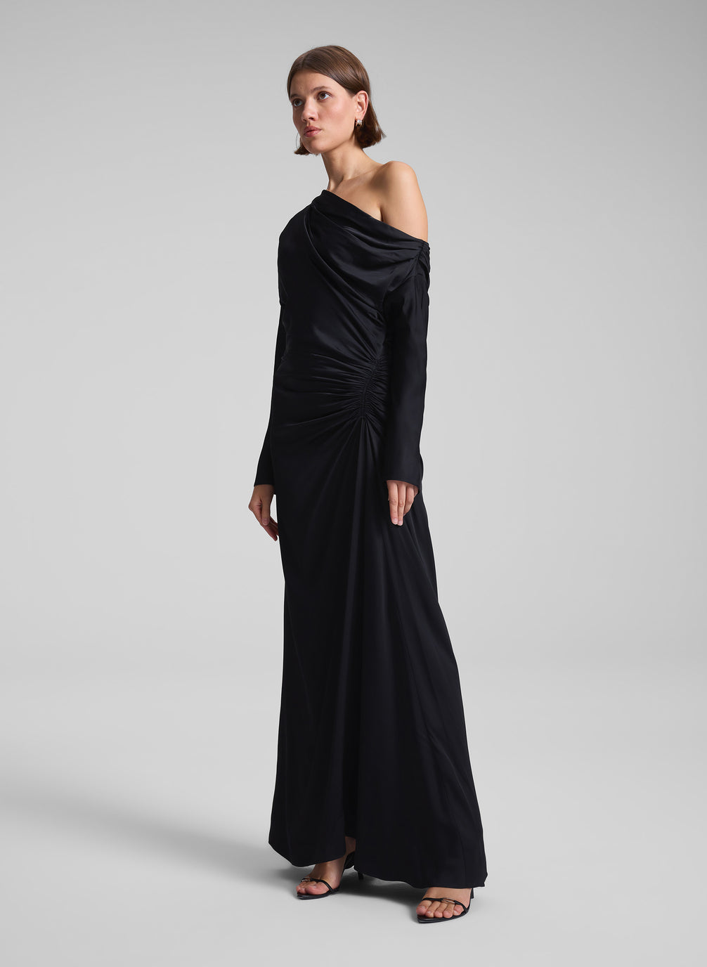 woman wearing black satin gown