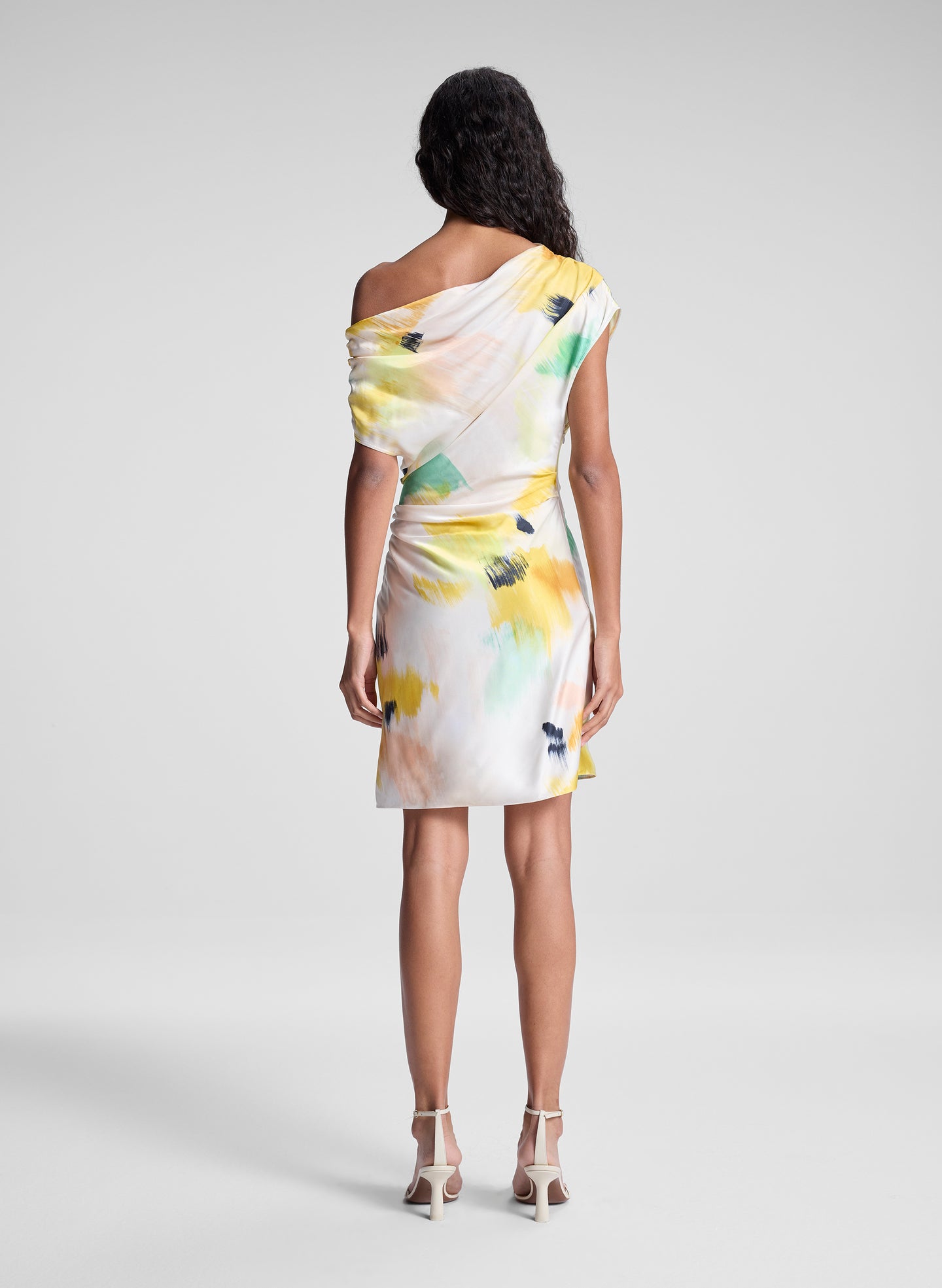 woman wearing floral mini dress