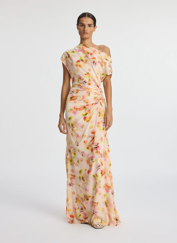 front view of woman wearing abstract print satin one shoulder maxi dress