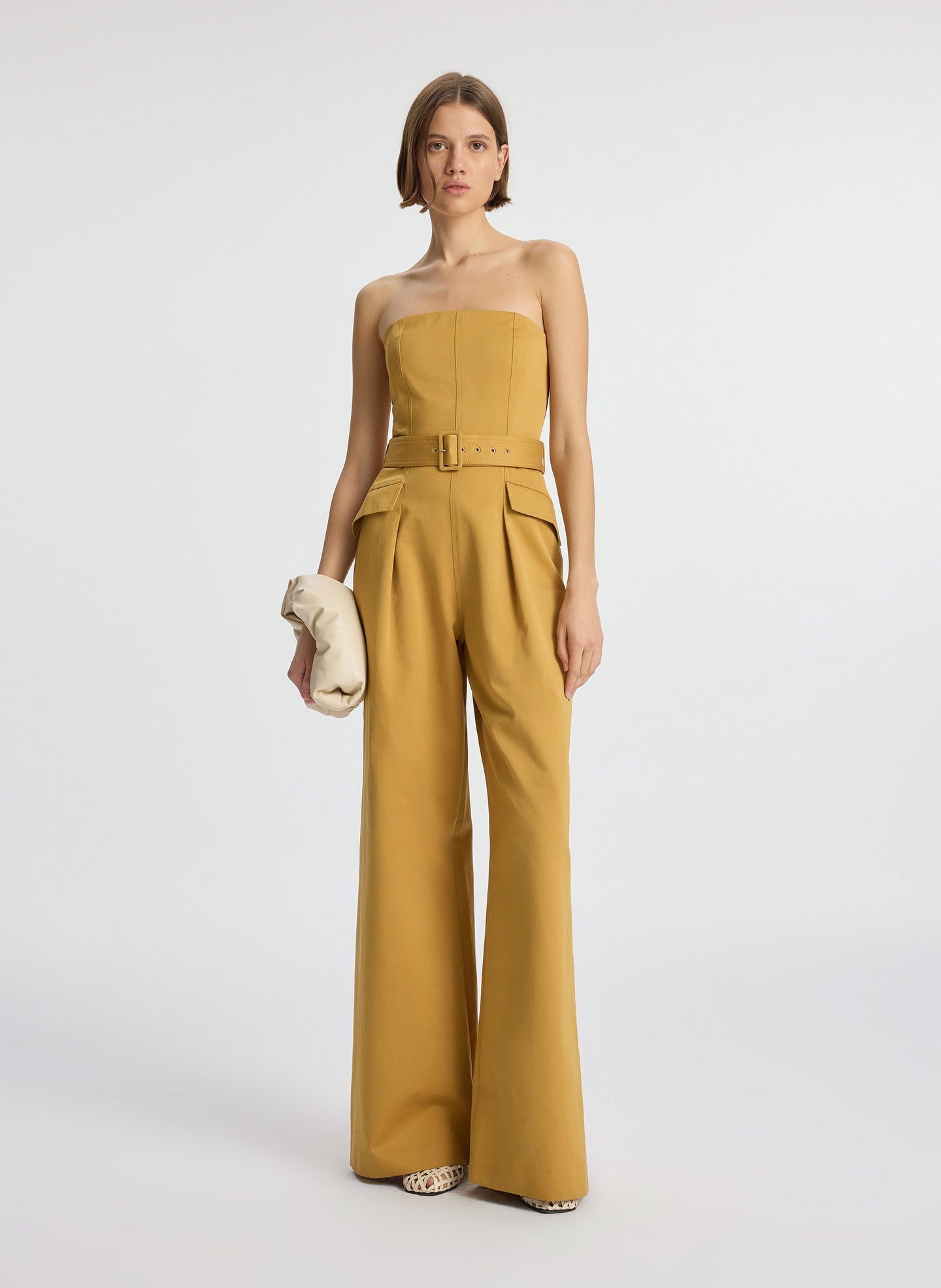 front view of woman wearing tan jumpsuit