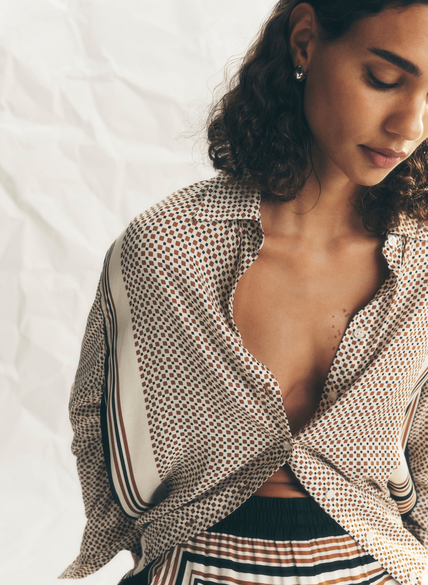 woman wearing scarf print top