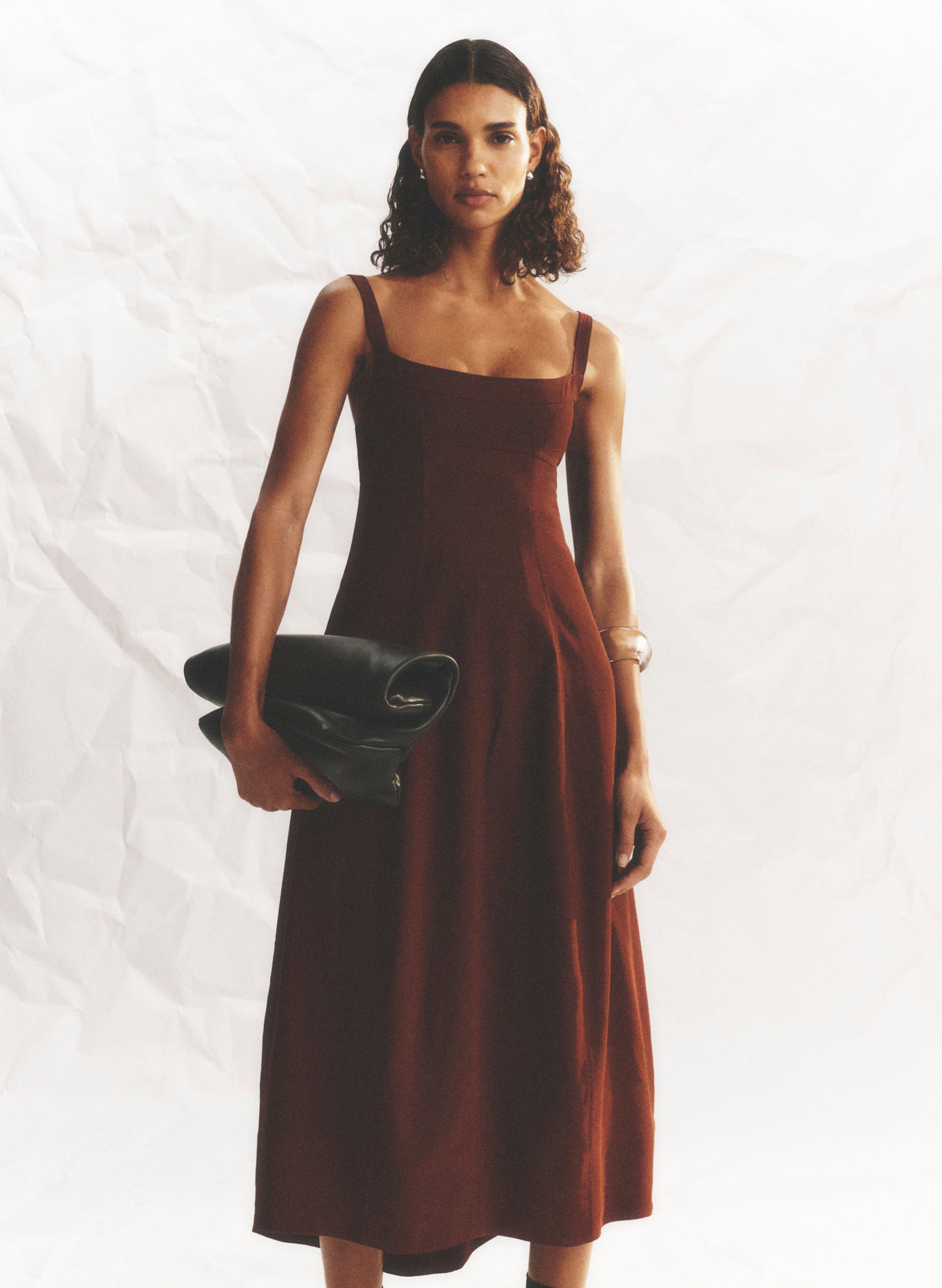 woman wearing maroon midi dress
