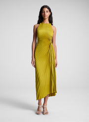 woman wearing pleated satin dress in yellow