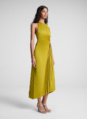 woman wearing pleated satin dress in yellow
