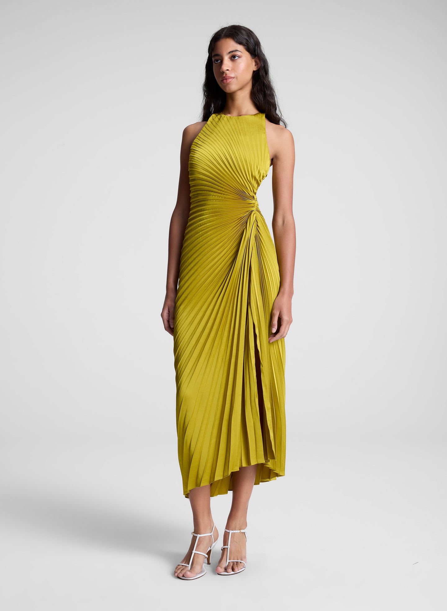 woman wearing pleated satin dress in yellow