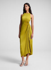 woman wearing pleated satin dress in yellow