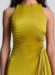 woman wearing pleated satin dress in yellow