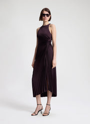 woman wearing purple pleated midi dress