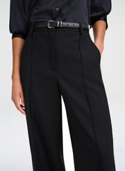 woman wearing black pants with belt