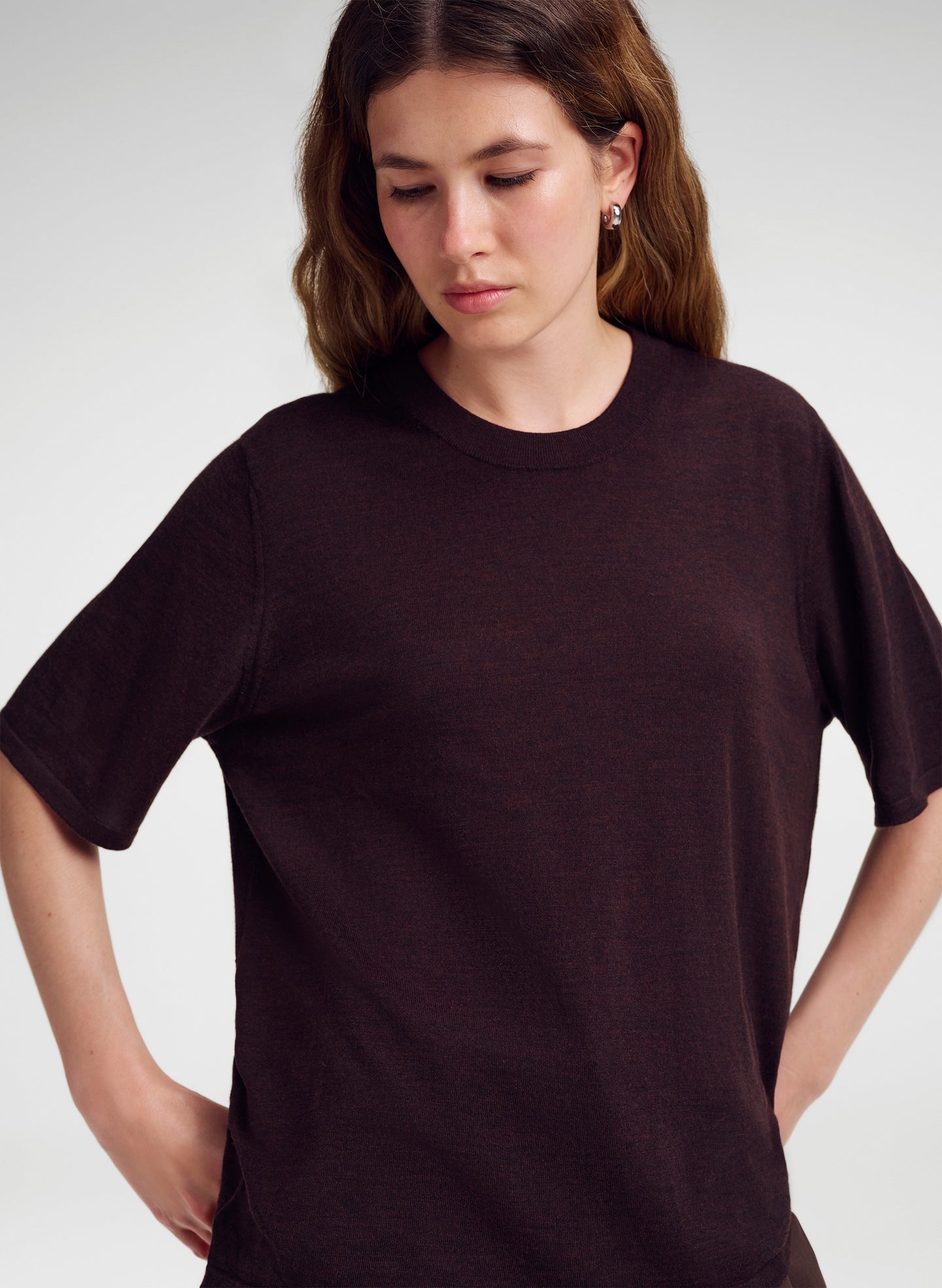 woman wearing brown knit merino top