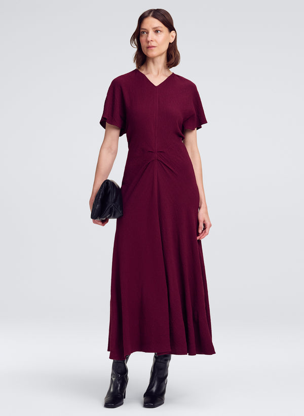 woman wearing red short sleeve midi dress