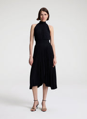 woman wearing black pleated midi dress