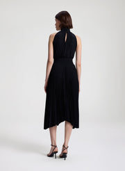 woman wearing black pleated midi dress