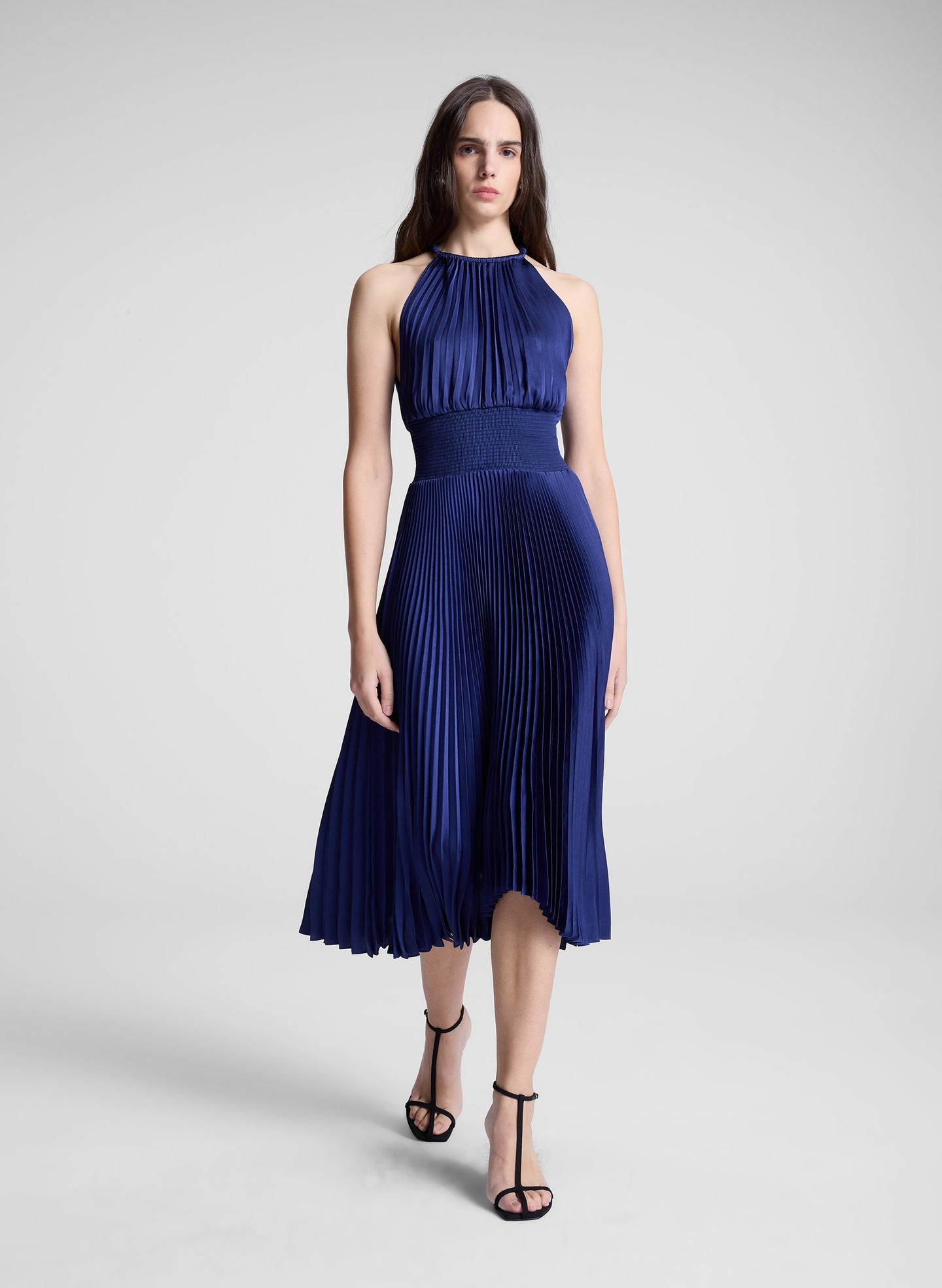 woman wearing blue pleated midi dress
