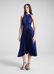woman wearing blue pleated midi dress