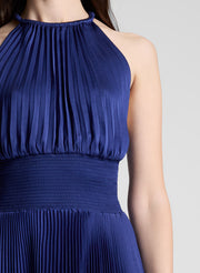woman wearing blue pleated midi dress