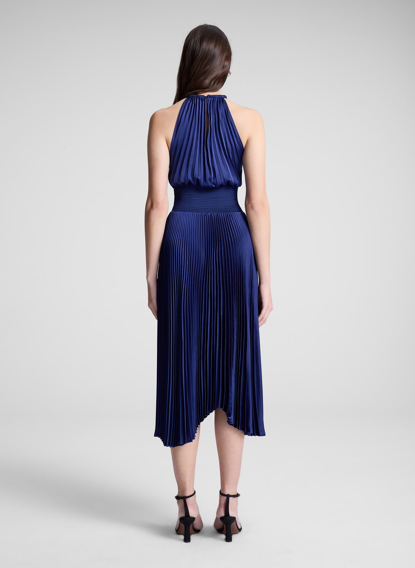 woman wearing blue pleated midi dress