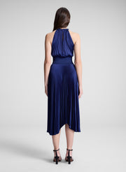 woman wearing blue pleated midi dress