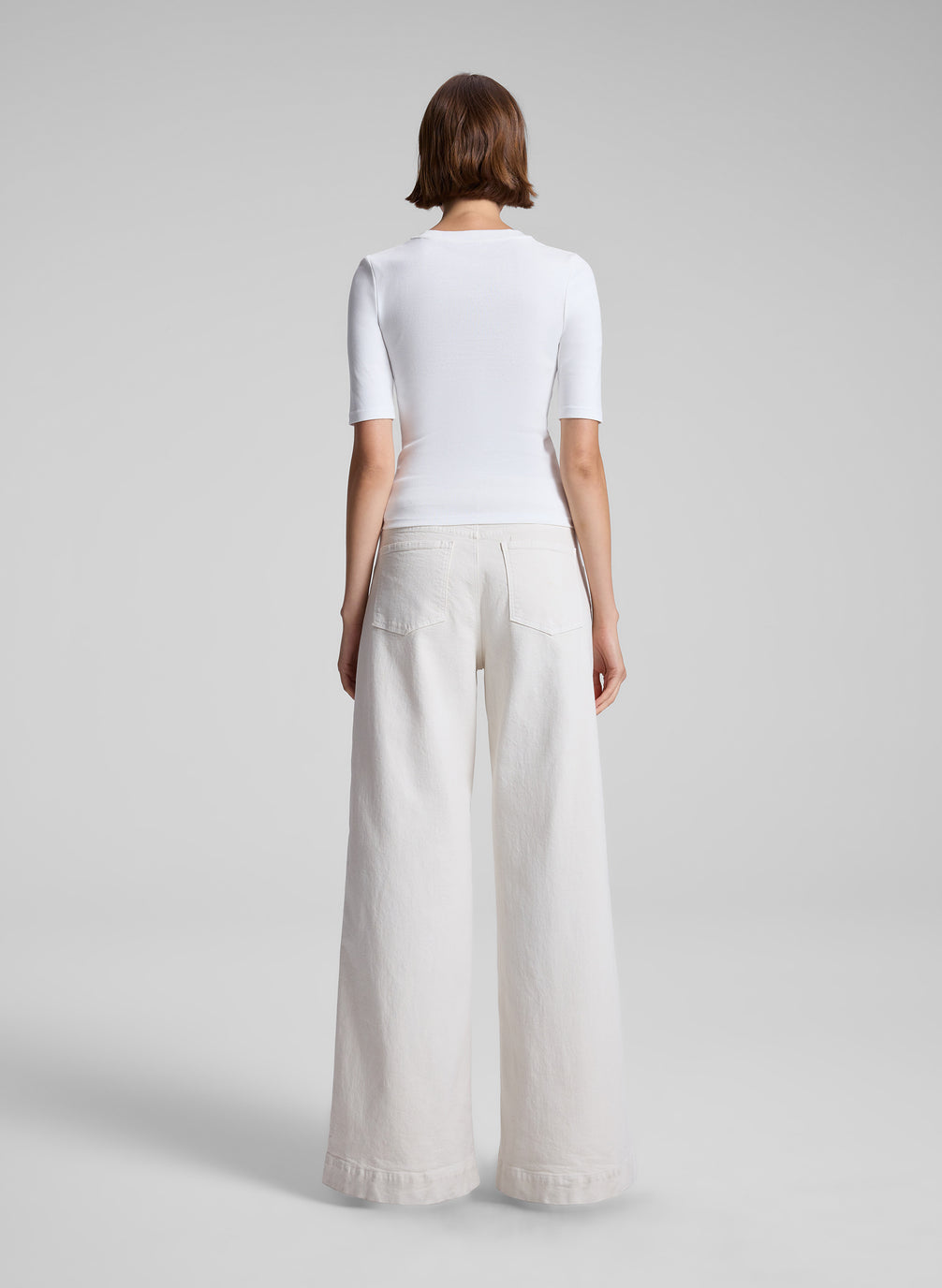 woman wearing white tshirt and white denim pant