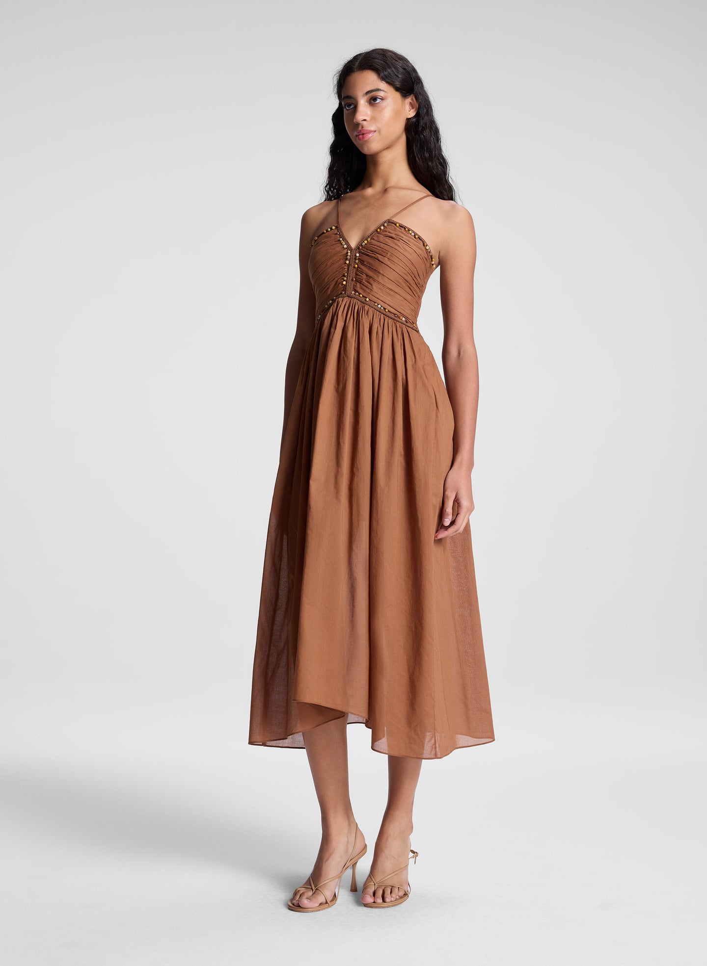 woman wearing light brown midi dress