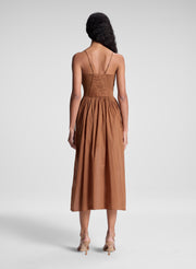 woman wearing light brown midi dress