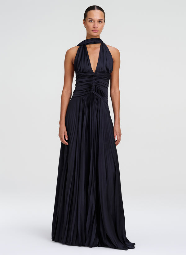 woman wearing navy blue pleated gown