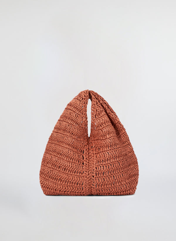 front view of small raffia woven handbag in brown