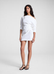 woman earing white off shoulder mini dress