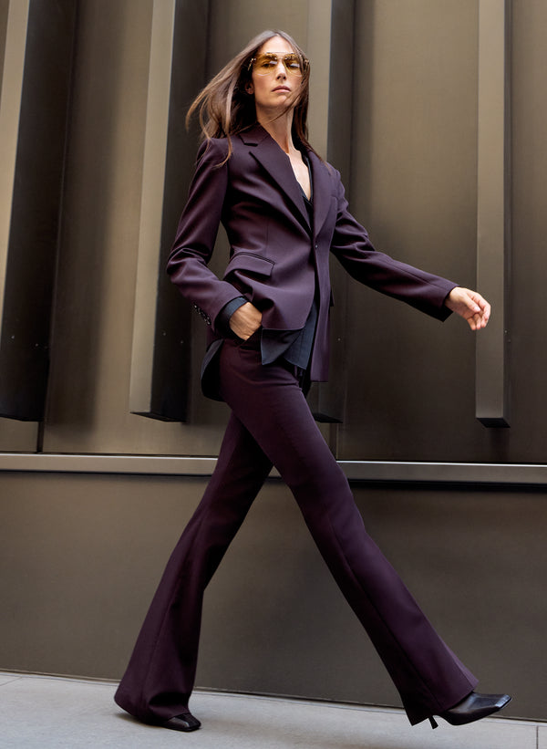 woman wearing purple suit
