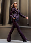 woman wearing purple suit