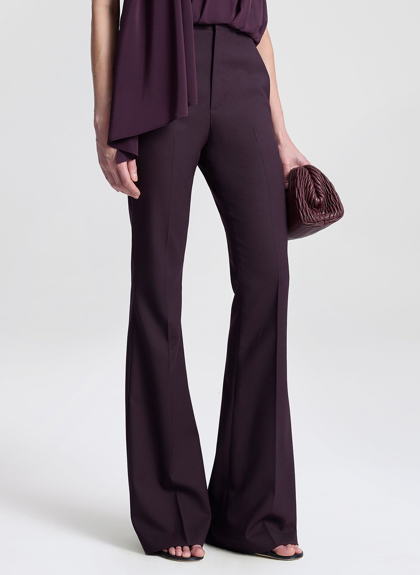 woman wearing purple top and purple pants