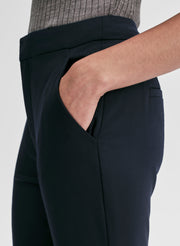 woman wearing grey merino tank and navy blue pants