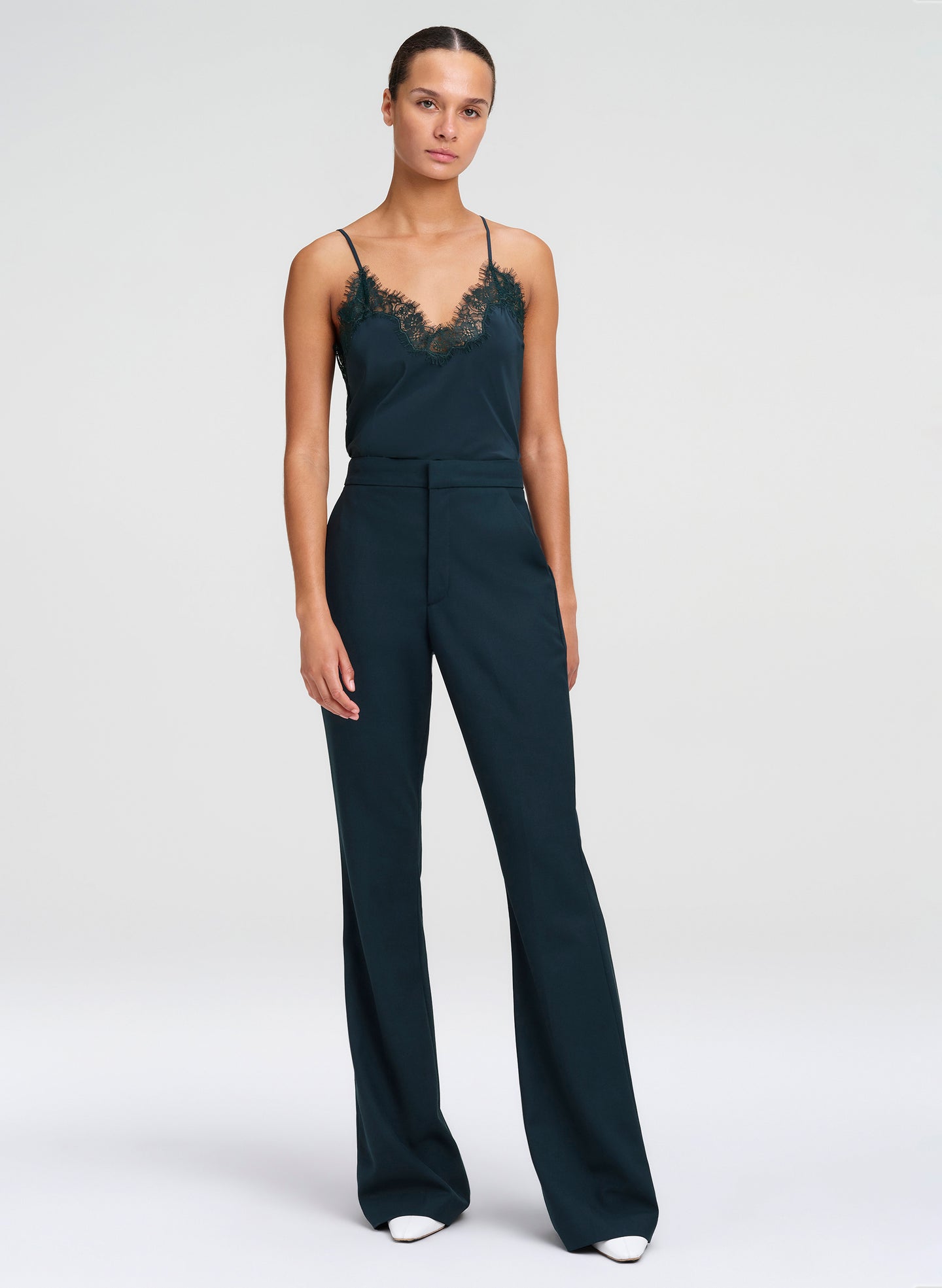 woman wearing green camisole top and green pants