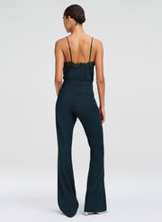 woman in green camisole top and green pants