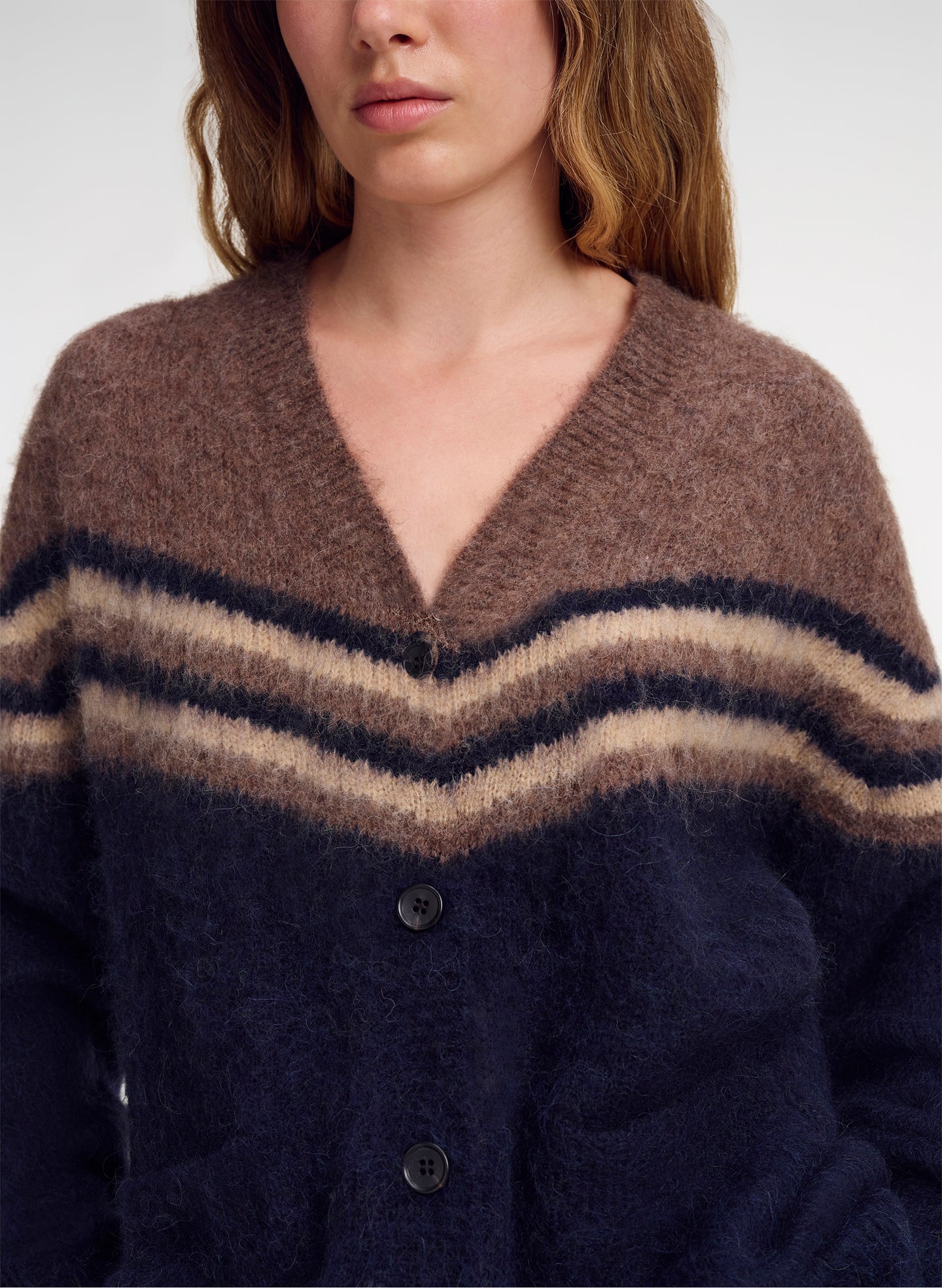 close up of brown and navy blue cardigan
