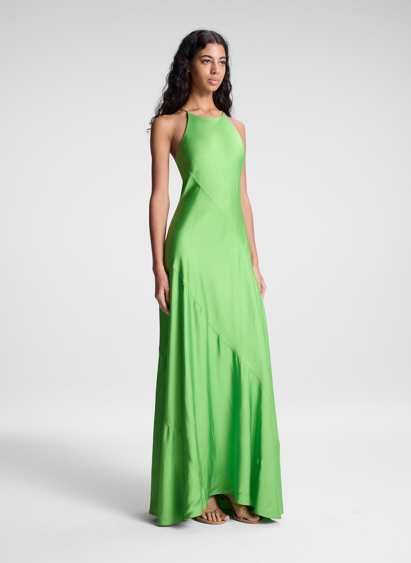woman wearing green maxi dress