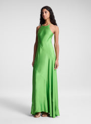 woman wearing green maxi dress