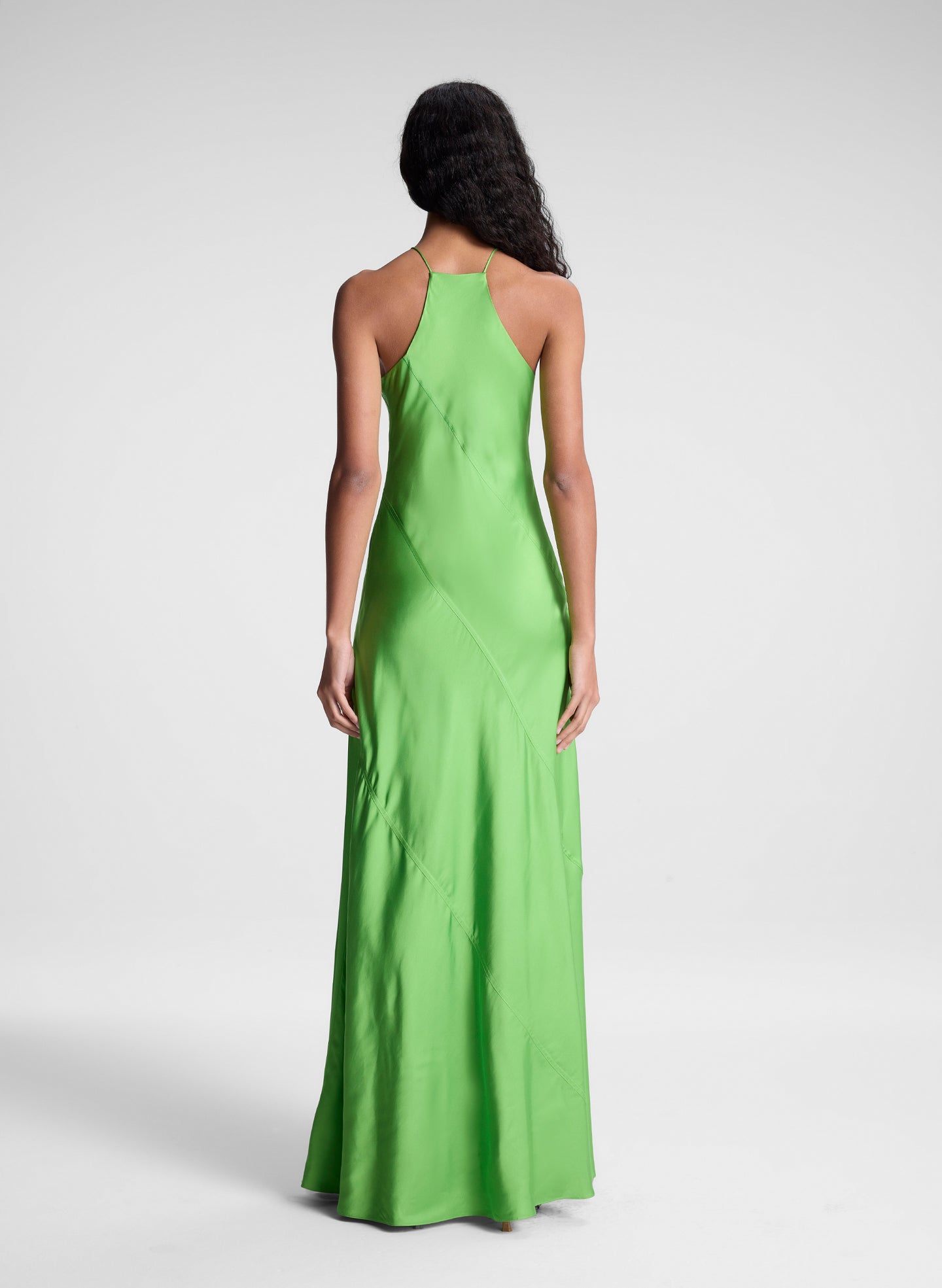 woman wearing green maxi dress