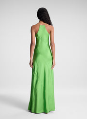 woman wearing green maxi dress