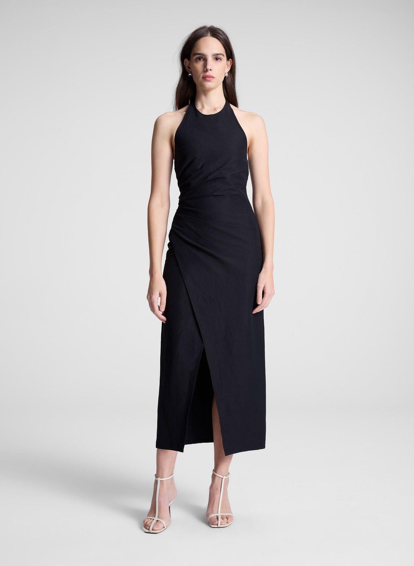 woman wearing black midi halter dress