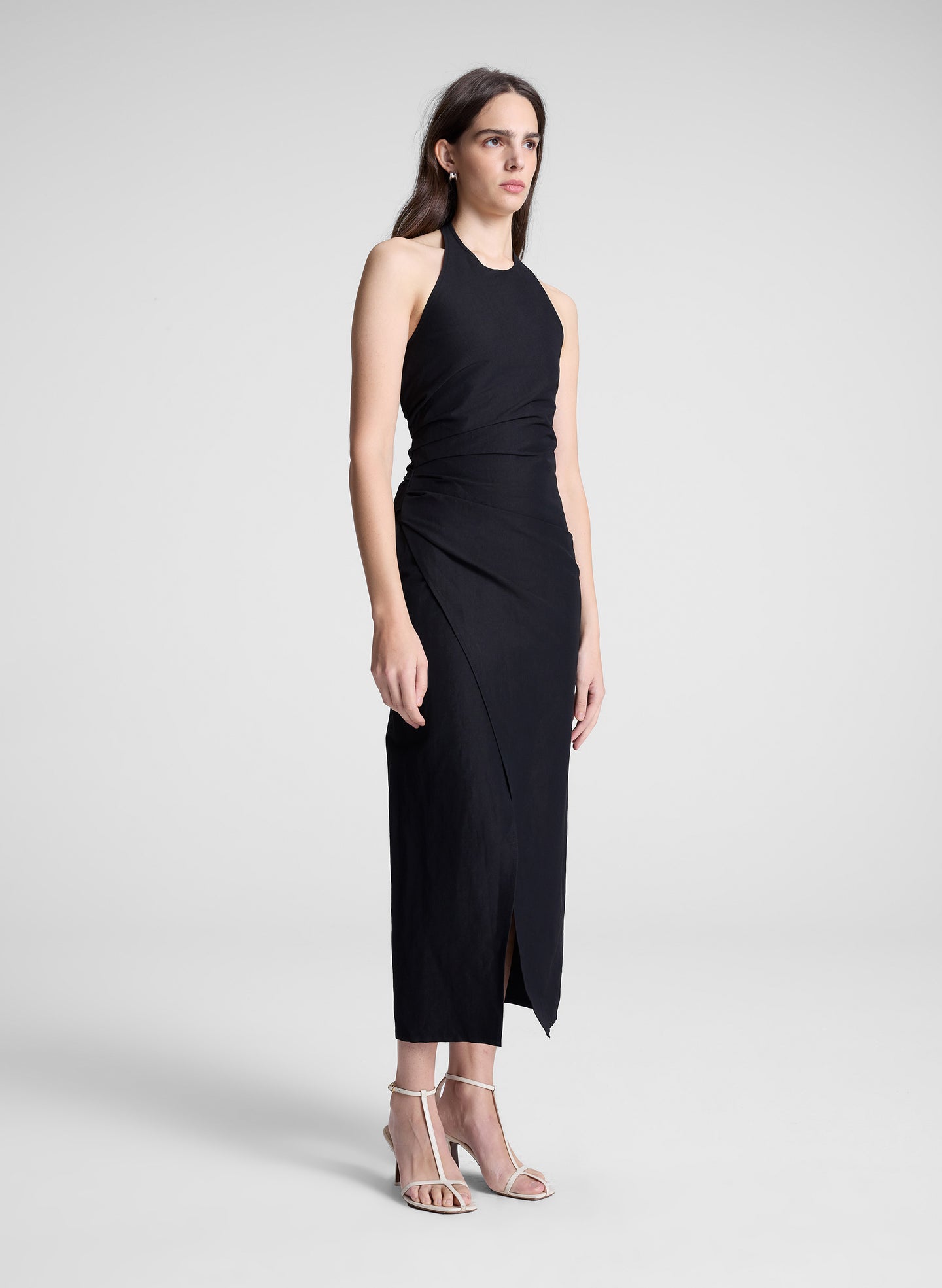 woman wearing black midi halter dress