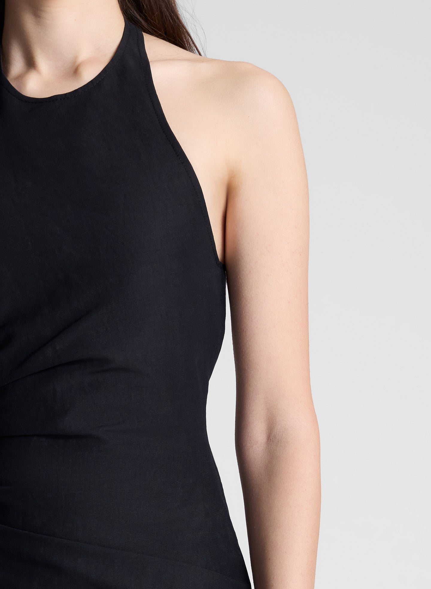 woman wearing black midi halter dress