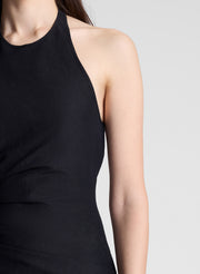 woman wearing black midi halter dress