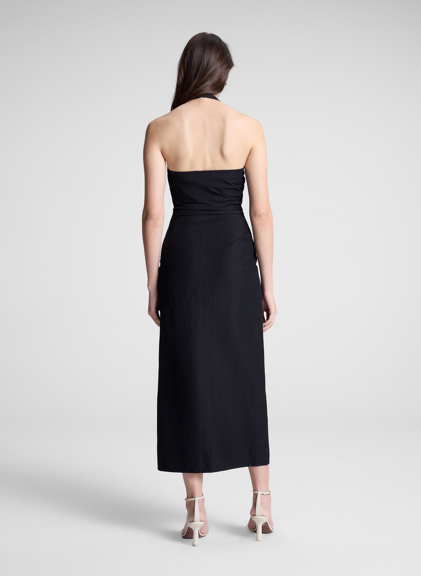 woman wearing black midi halter dress