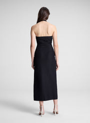 woman wearing black midi halter dress