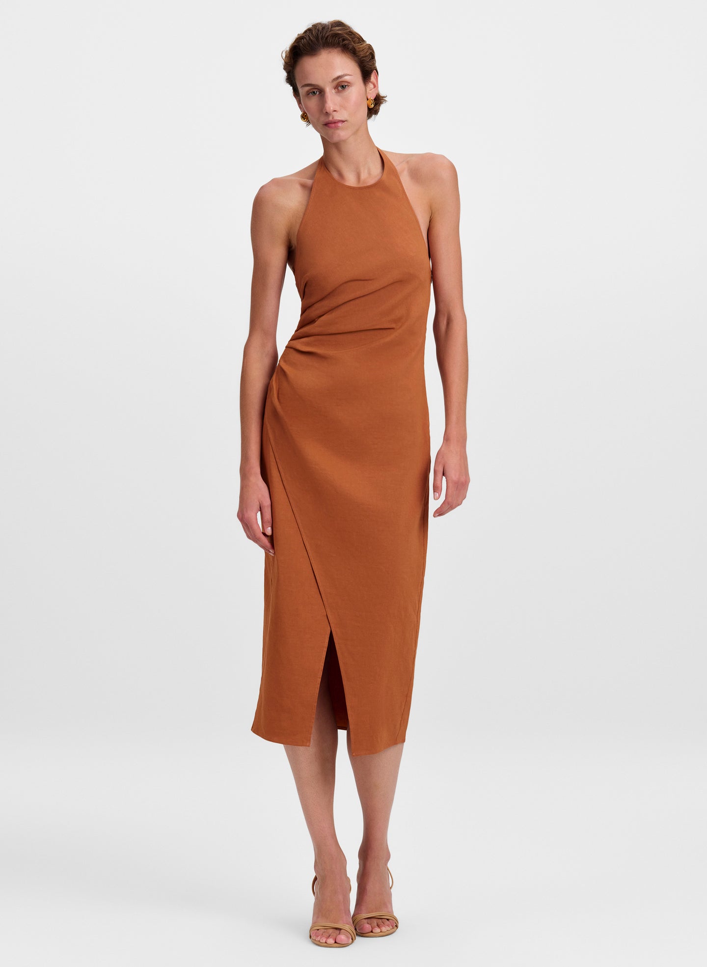 woman wearing rust color halter midi dress