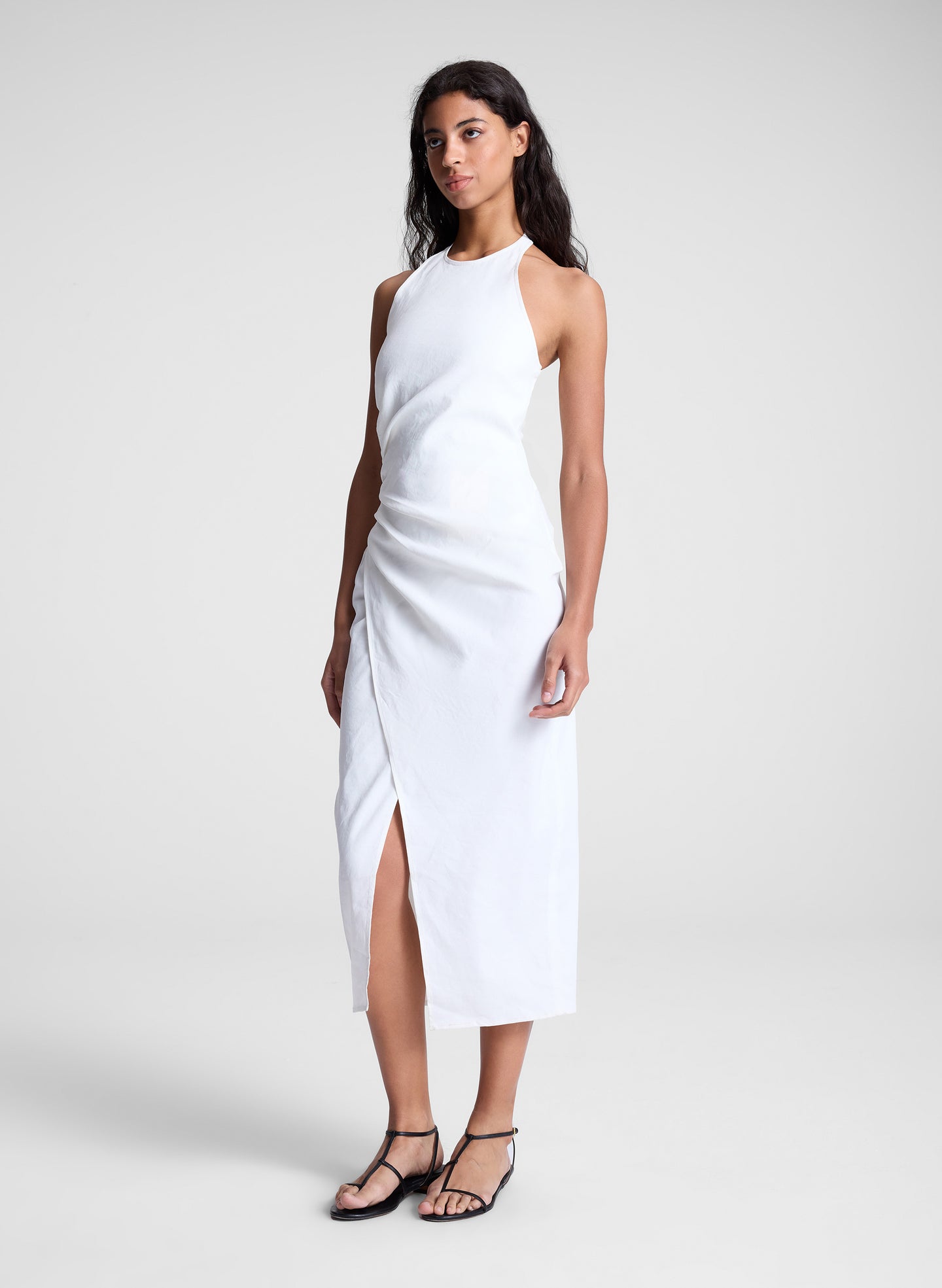 woman wearing white midi halter dress