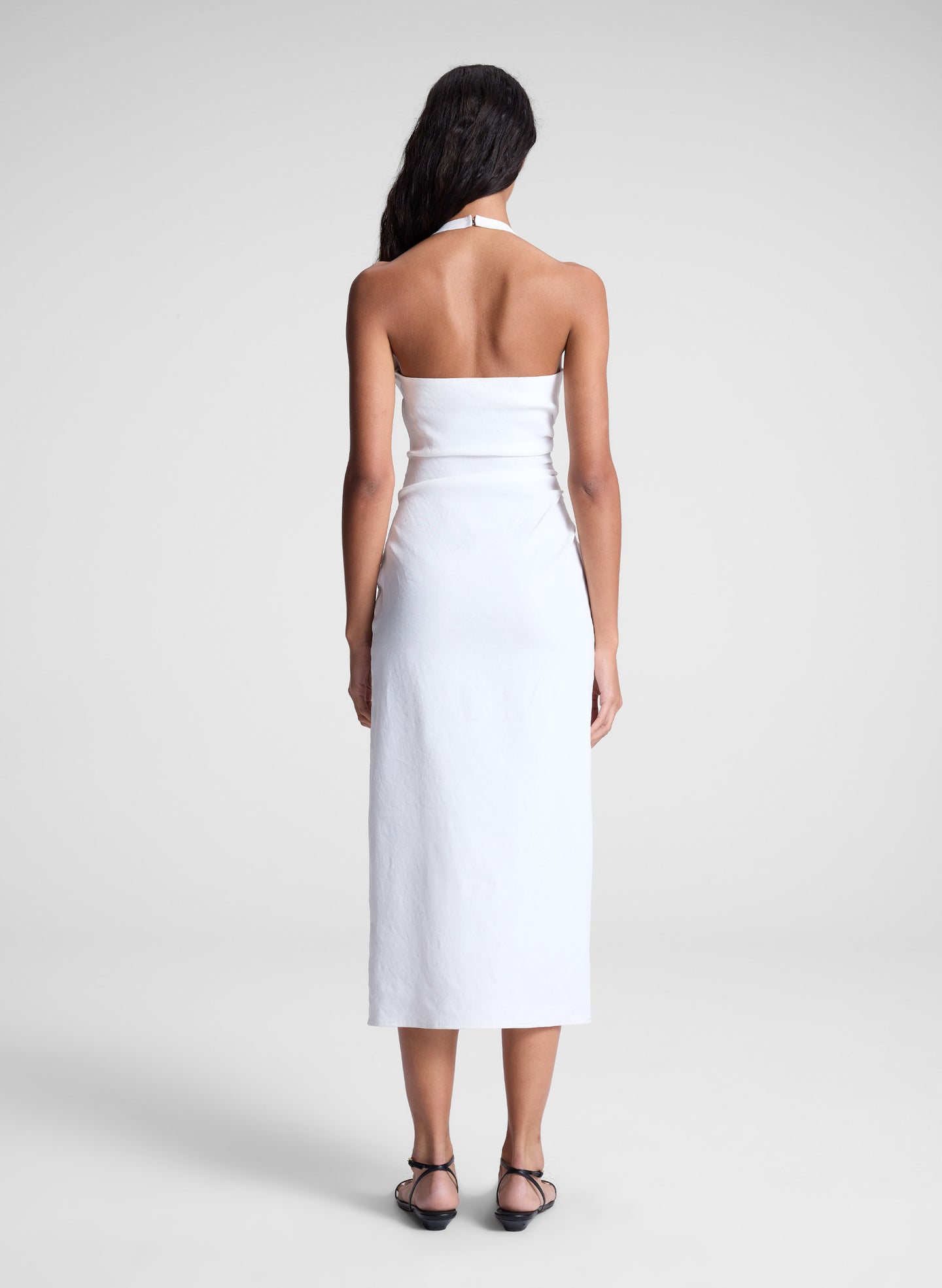 woman wearing white midi halter dress