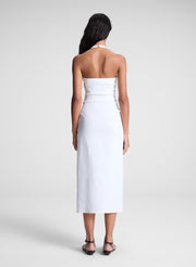 woman wearing white midi halter dress