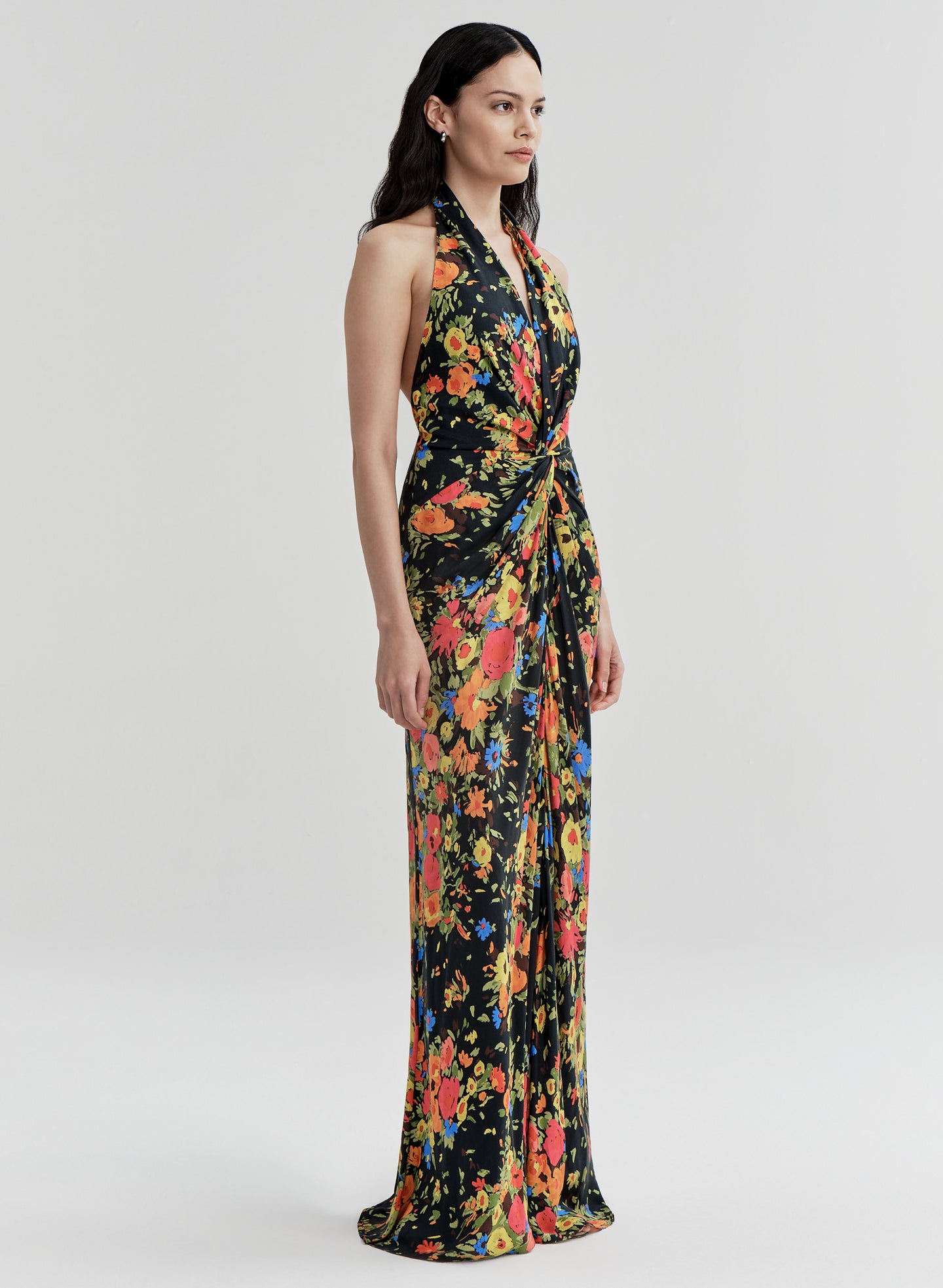 Woman wearing a floral gown on a white background